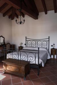 Posteľ alebo postele v izbe v ubytovaní Locanda OSTERIA LA MILONGA