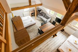 an overhead view of a living room and kitchen in a tiny house at ElbPension & Ferienwohnung Sächsische Schweiz in Pirna