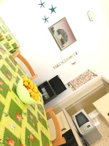 a room with a bed with fruit on it at Sunset Salentorelax San Gregorio in Marina San Gregorio