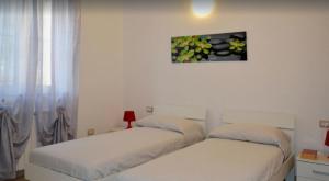 A bed or beds in a room at Casa di Gian