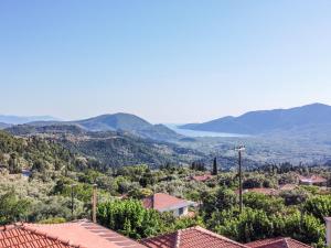 a view of a town with mountains in the background at La Olga Apartment Lefkada in Sívros