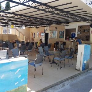 a group of chairs and tables in a building at Hostel best offer in Dubrovnik