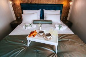 Ein Bett oder Betten in einem Zimmer der Unterkunft Luxury Rooms VINDEMIÆ