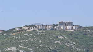 a group of buildings on top of a hill at 1bd Sea View Apts Veliki Pjesak "Mula" in Dobra Voda