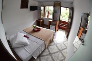 Postel nebo postele na pokoji v ubytování Pousada Pico das Praias