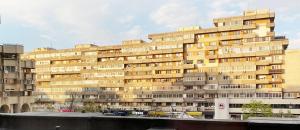 a large building with many windows on the side of it at Spacious Apartment in City Centre in Iaşi