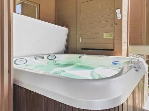 a white bath tub in a bathroom at B11 Powder Run condo in Park City