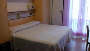 Cama o camas de una habitación en Hotel Trocadero
