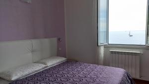 Postel nebo postele na pokoji v ubytování La Terrazza sul Mare Affittacamere + 17 fotografií