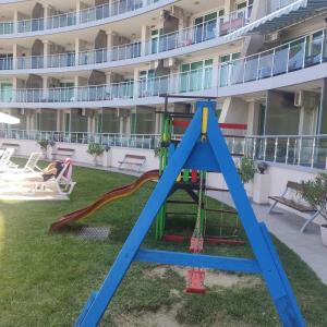 a playground in the courtyard of a hotel at Silver A28 in Byala