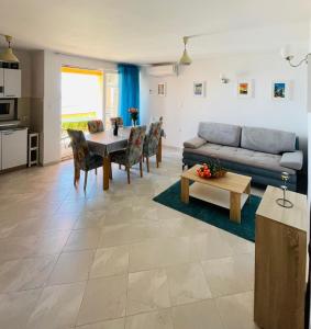 a living room with a couch and a table at VillaMar in Pag