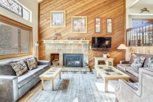 a living room with a couch and a fireplace at Multi-level Cedars 2 Townhome in Breckenridge