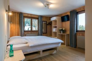 Voodi või voodid majutusasutuse La Vallée Hôtel &Spa toas