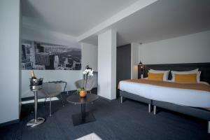 Cama ou camas em um quarto em Central Park Hôtel & Spa