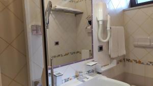 a bathroom with a sink and a shower at La Contessa Hotel e b&b in Mercogliano