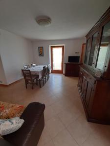 a living room with a table and a couch at Casa/Villa Sommavilla in Brenzone sul Garda +9 photos
