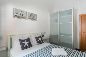 a bedroom with a bed with stars on it at Accommodation Triton in Lastovo