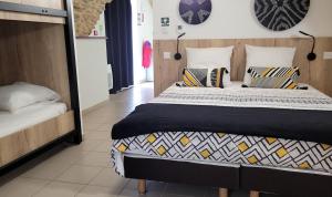 Cama o camas de una habitación en Hostel les Terrasses du Roc