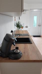 a kitchen counter with a hair dryer on top of it at Tauberperle in Weikersheim