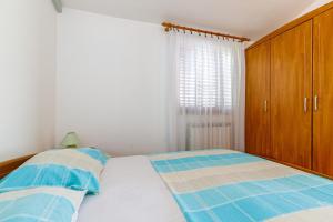 Postel nebo postele na pokoji v ubytování Apartments Slavko
