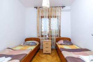 Postel nebo postele na pokoji v ubytování Apartments Slavko