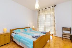 Postel nebo postele na pokoji v ubytování Apartments Slavko