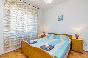 Postel nebo postele na pokoji v ubytování Apartments Slavko