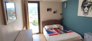 a small bedroom with a bed and a window at Les Terrasses de Provence in Peypin +23 photos