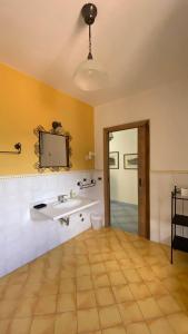 a bathroom with a sink and a mirror at Monolocale & Suite Casa Santicelli Maratea in Maratea