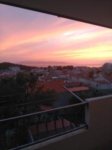 a view of a sunset from a balcony at Apartment Sky Central in Makarska