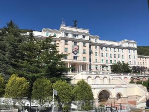 a large white building with a face on it at Albergo pensione Bianco in San Giovanni Rotondo