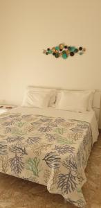 Postel nebo postele na pokoji v ubytování Grimaldi Guest Apartment