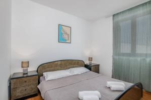 Ein Bett oder Betten in einem Zimmer der Unterkunft Apartment Dora Klimno