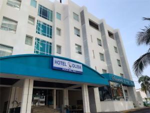 a hotel and office building with a sign on it at HOTEL OLIBA Boca del Rio in Boca del Río