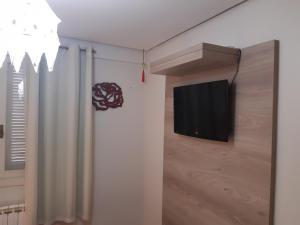 A television and/or entertainment centre at Dona Beatriz 11