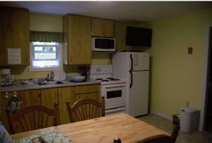 
A kitchen or kitchenette at Forest & Lake PEI Cottages
