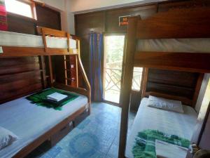 Postel nebo postele na pokoji v ubytování Esperanto Bed & Breakfast Surf Hostel