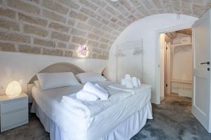 Postel nebo postele na pokoji v ubytování B&B Trulli Moonlight da Grace