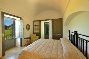 Posteľ alebo postele v izbe v ubytovaní Masseria Trulli e Vigne