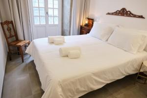 Postel nebo postele na pokoji v ubytování Casas do Mercado - Casa Orion