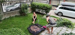 a man and a woman standing in a yard at The English Guest House in Ruse