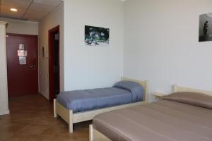 Postel nebo postele na pokoji v ubytování Student's Hostel Parma