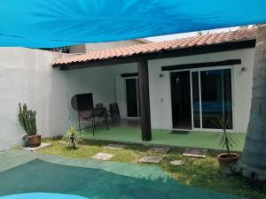 a view of a house with a patio at Casa Kanté in Tamasopo