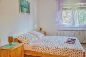 Кровать или кровати в номере Apartment Rašće