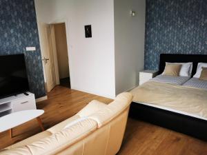 Postel nebo postele na pokoji v ubytování APARTAMENTY PRZY PARKU- Parking GRATIS!!!