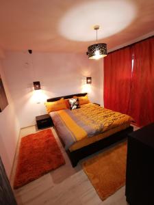 Ένα ή περισσότερα κρεβάτια σε δωμάτιο στο Apartament Kalinderu K3 Busteni