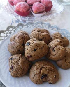 a plate of cookies and cupcakes on a table at Gioia In Collina in Torrevecchia Teatina