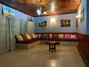 a living room with a couch and a table at Pazuri Hostel in Moshi