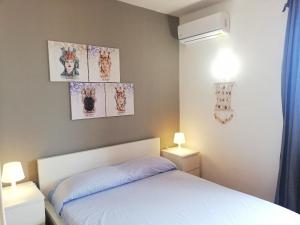 Posteľ alebo postele v izbe v ubytovaní Saracena Amuri Home