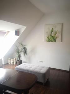 Ένα ή περισσότερα κρεβάτια σε δωμάτιο στο Apartamenty LENA 16 TWOJE poddasze